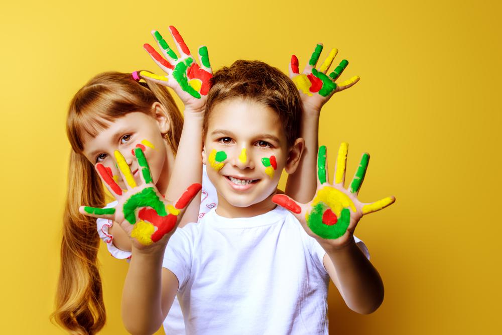 Children with colorful painted hands
